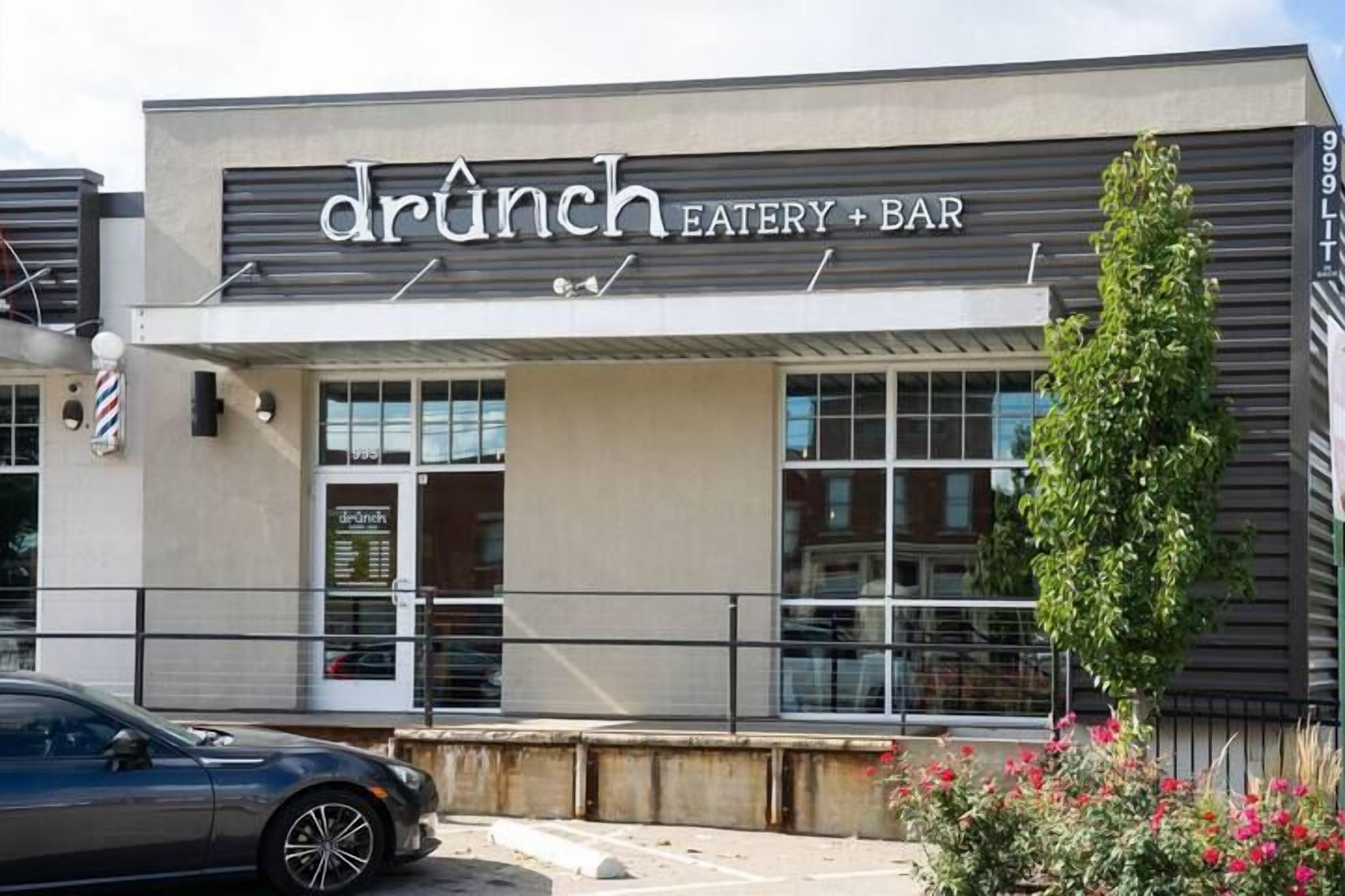 A building with a sign reading 'drunch EATERY + BAR'.