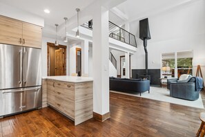 A spacious kitchen with a large island, stainless steel appliances, and a modern design. - Spring/Summer Vacation Away From the Big City in the Great Northwest of Montana. (Kalispell)