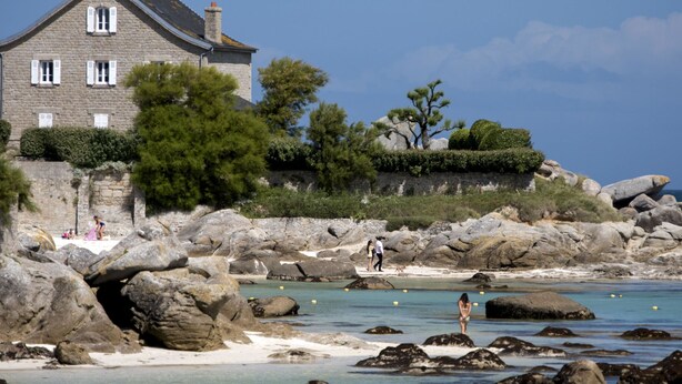 A coastal house with a stone facade, large windows, and a prominent chimney. - Au Gré du Vent by Interhome (Brignogan-Plage)