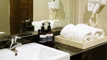 Shower, designer toiletries, bidet, towels