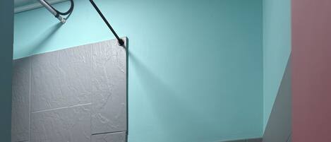 Shower, hair dryer, towels, toilet paper