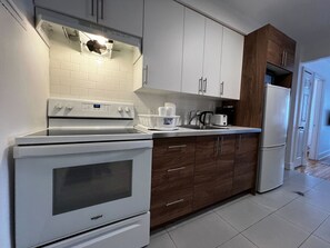 Fridge, microwave, stovetop, coffee/tea maker