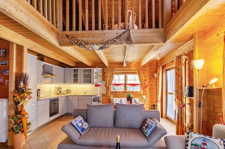 TV. Holiday Home 'Emslandstube' with Lake View, Private Terrace and Private Garden
