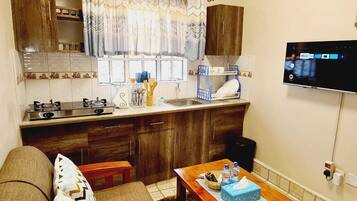 Business Studio | Living area | 24-inch Smart TV with digital channels