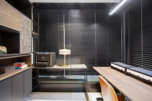 A modern office space with a desk, printer, lamp, and storage cabinets. - Aurum 501 (Cape Town)
