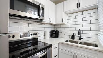 Fridge, coffee/tea maker, cookware/dishes/utensils