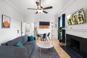 TV, fireplace, books