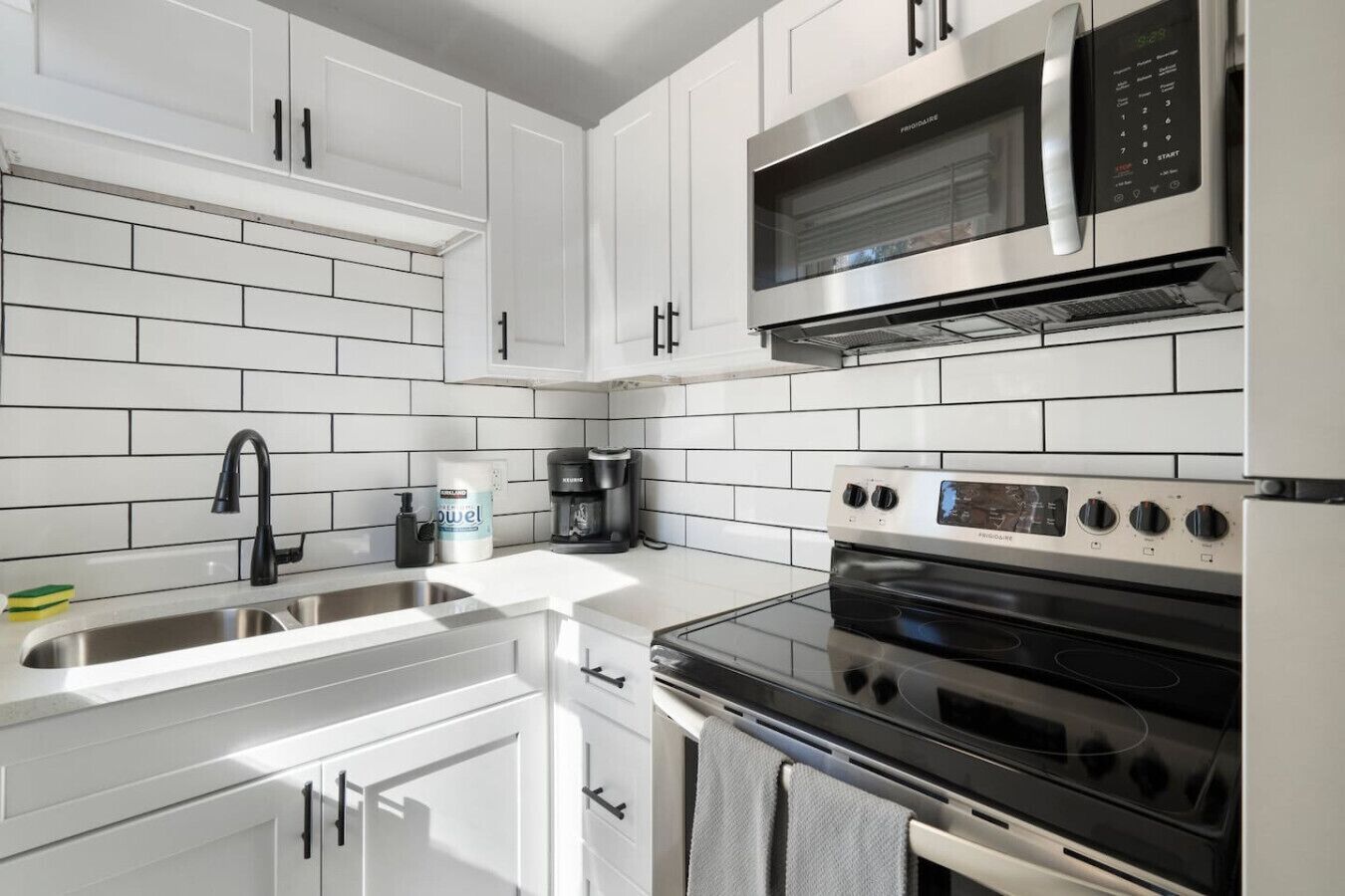 Fridge, coffee/tea maker, cookware/dishes/utensils