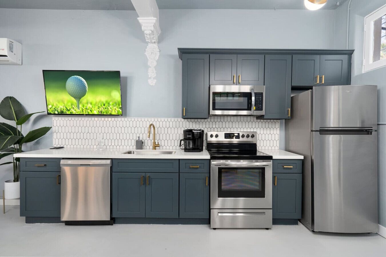 Fridge, microwave, coffee/tea maker, cookware/dishes/utensils