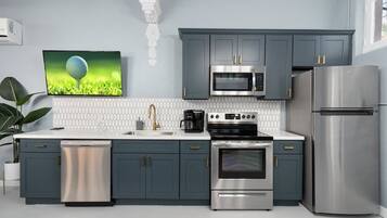 Coffee/tea maker, fridge, microwave, cookware/dishes/utensils