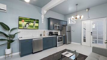 Fridge, microwave, coffee/tea maker, cookware/dishes/utensils