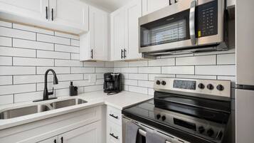 Fridge, stovetop, coffee/tea maker, cookware/dishes/utensils