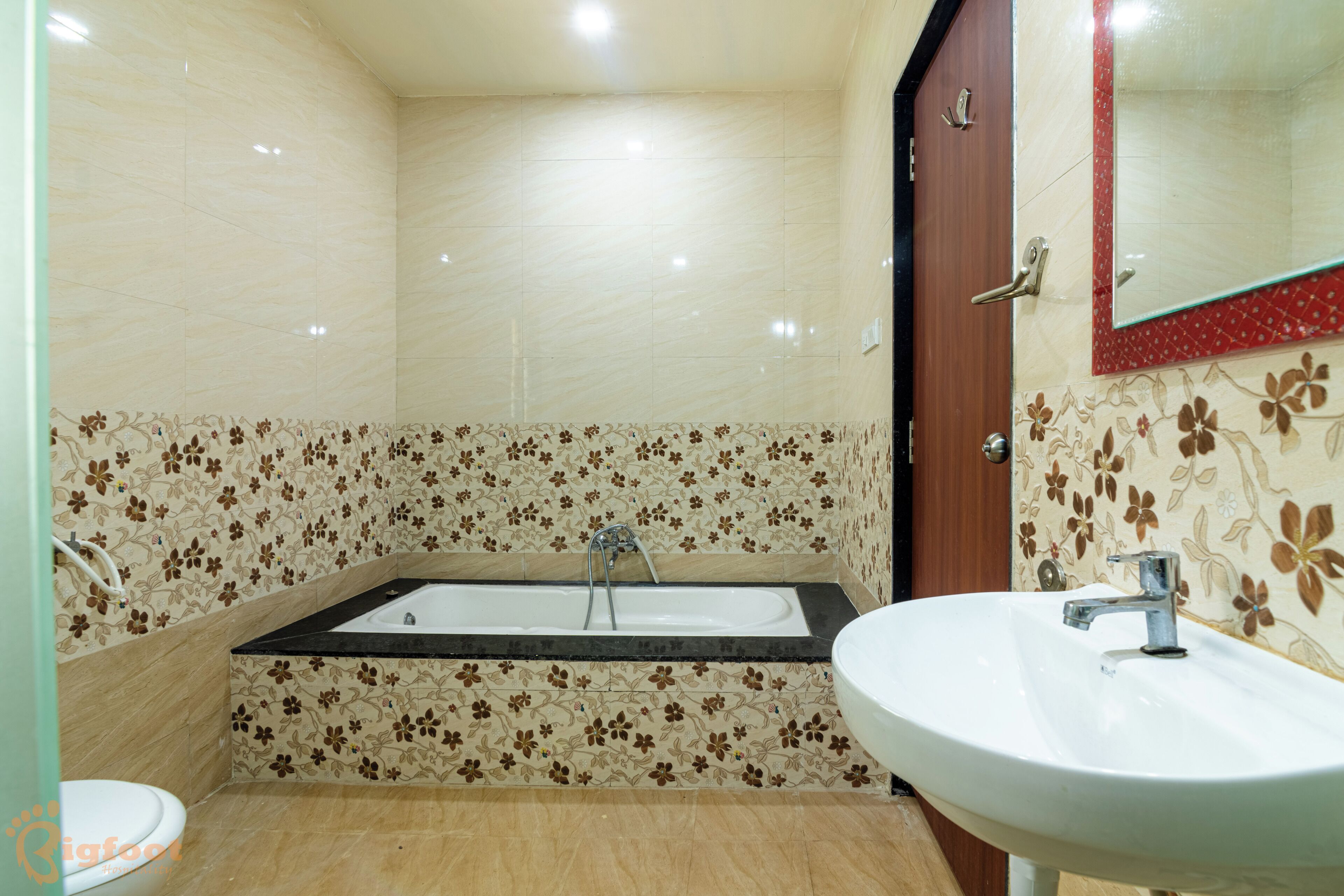 A bathroom with a bathtub, a sink, and a toilet.