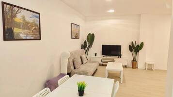 Classic Apartment, 3 Bedrooms, City View | Living area | 40-inch flat-screen TV with digital channels