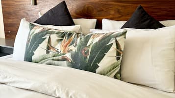 Deluxe Room | Hypo-allergenic bedding, down comforters, in-room safe