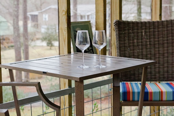 Serenity at its finest: Embracing the tranquil beauty of lakeside living from the comfort of our charming porch