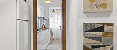 Premium Apartment | Private kitchen | Full-size fridge, microwave, stovetop, electric kettle
