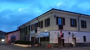 A street view of a building with a café and a construction sign.