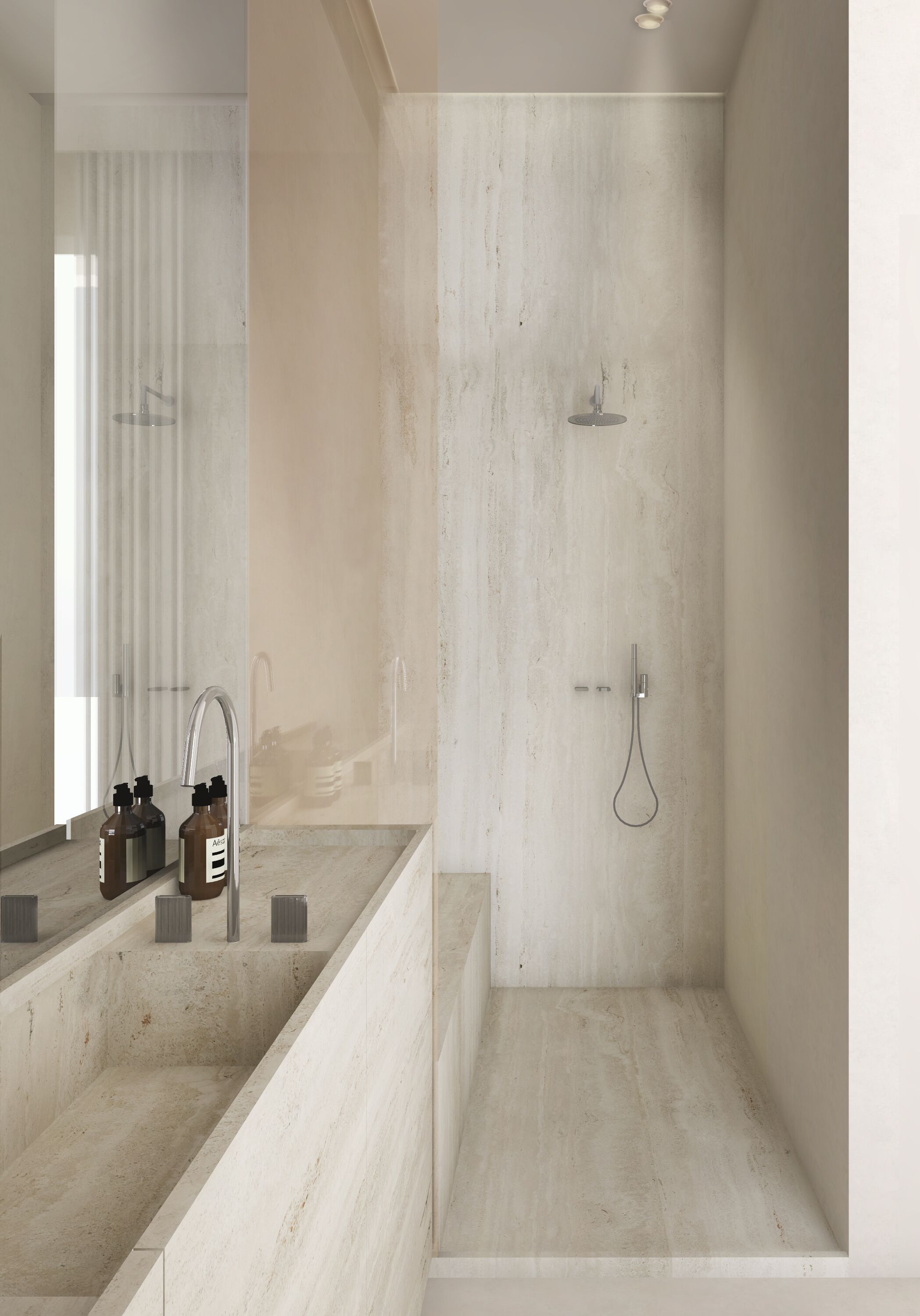 A modern bathroom with a large mirror, a shower, and a sink with two bottles of soap.
