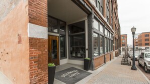 A building with a brick facade and large windows.