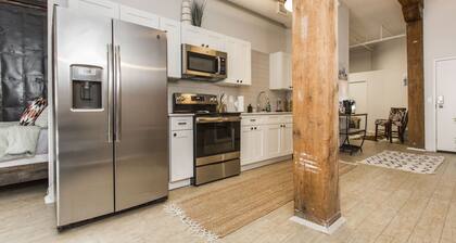 Spacious 2-bed loft with full kitchen, washer/dryer, city views, and in-building gym, game room, and coffee bar. Walkable location with streetcar access just steps away.