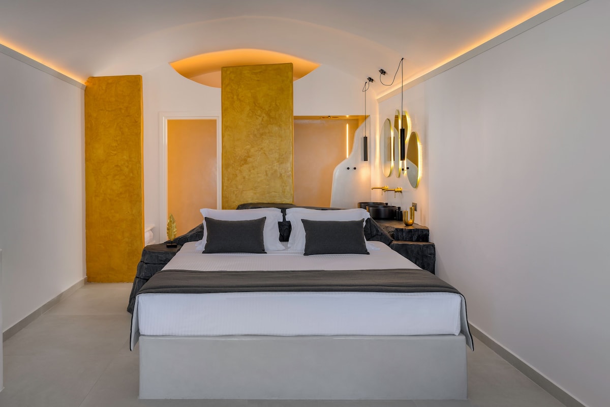 A modern bedroom with a large bed, bedside tables, a mirror, and a unique ceiling design.