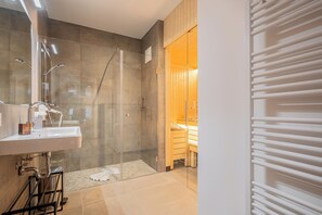 Shower, hair dryer, towels, soap