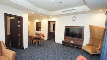 Family Suite | Living room | 55-inch Smart TV with satellite channels
