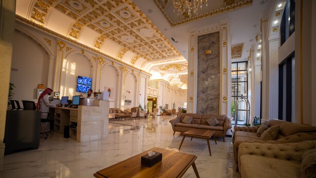 A luxurious lobby with marble floors, elegant furniture, and ornate ceiling details. - GUEST HOUSE FOR HOTELS APARTMENTS - جيست هاوس للشقق الفندقيه (Yanbu)