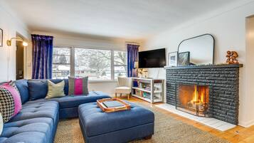 TV, fireplace, books
