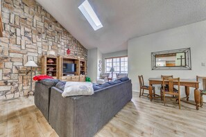 TV, fireplace, books - Expansive Ruidoso Home: Private Hot Tub + Deck (Ruidoso)