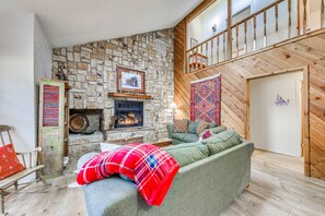 TV, fireplace, books - Expansive Ruidoso Home: Private Hot Tub + Deck (Ruidoso)