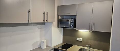 Fridge, microwave, stovetop, coffee/tea maker