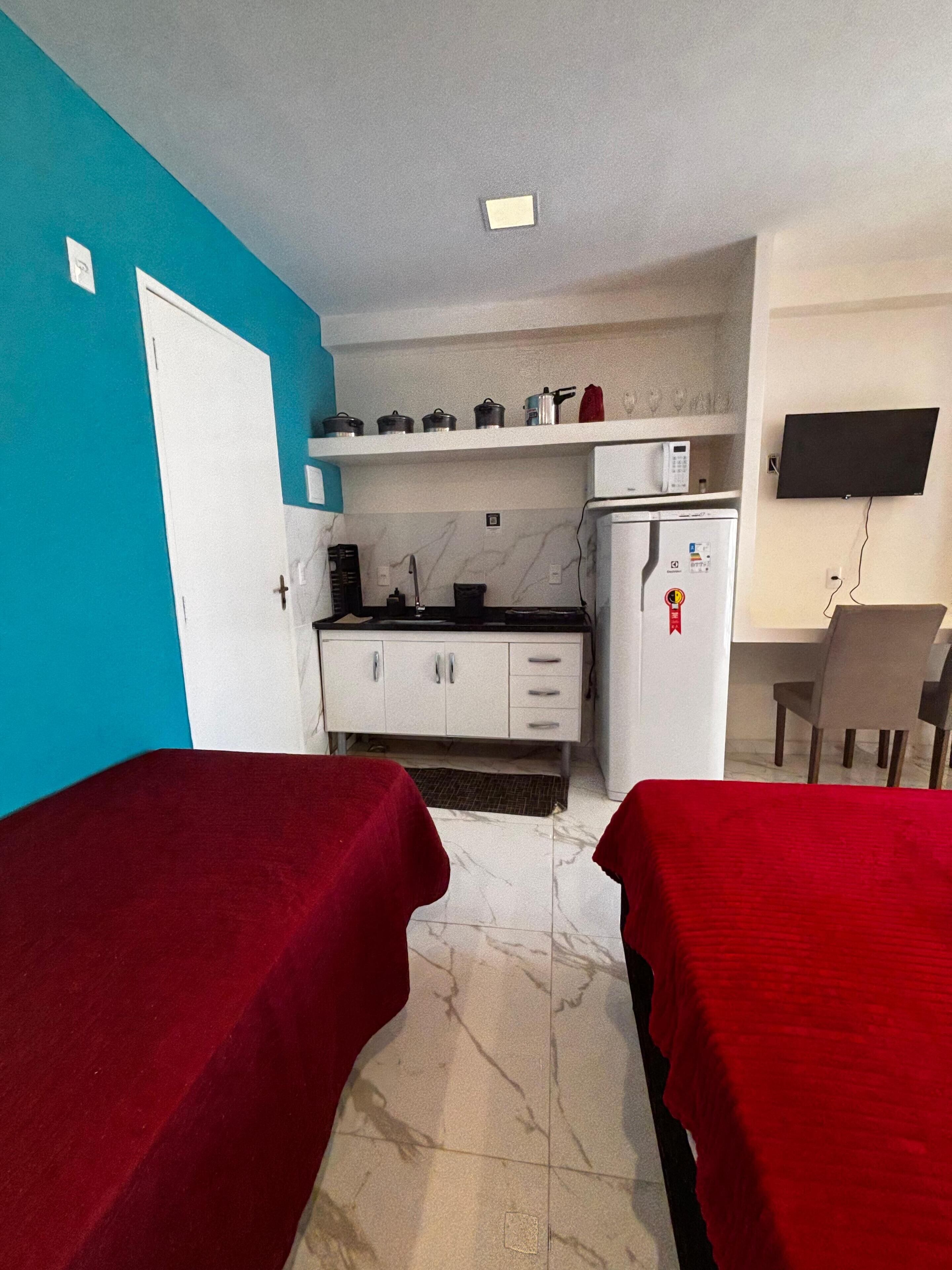 Deluxe Studio, 1 Bedroom, Air conditioning, Beach View | Private kitchen | Fridge, microwave, stovetop, highchair