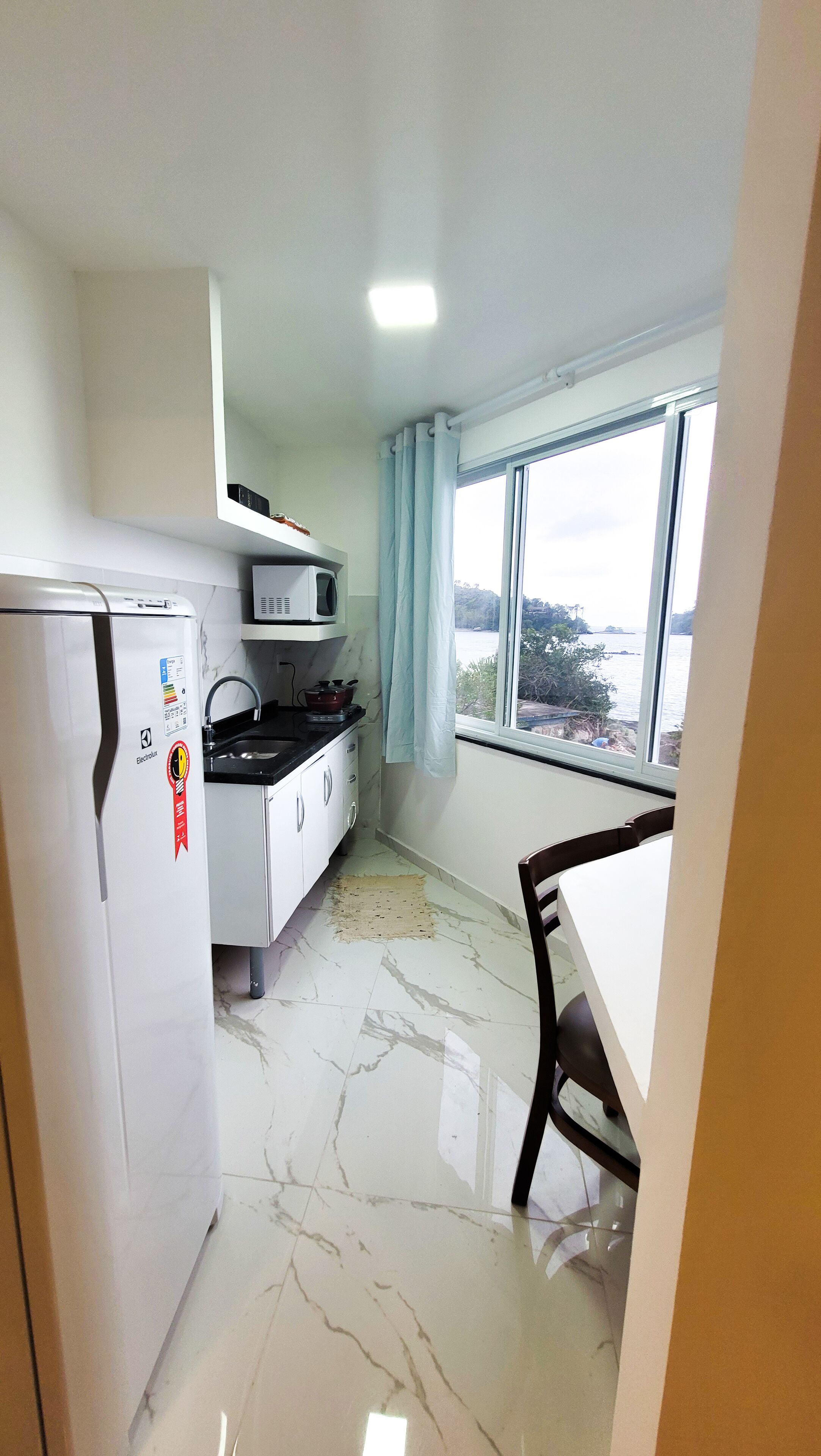 Deluxe Studio, 1 Bedroom, Air conditioning, Beach View | Private kitchen | Fridge, microwave, stovetop, highchair