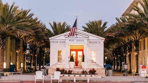 A small, white United States Post Office building with an American flag, located in Seaside, FL. - Seaside, FL Beach Home - Close to Pool & Beach; + 2 Adult Bikes! (Santa Rosa Beach)