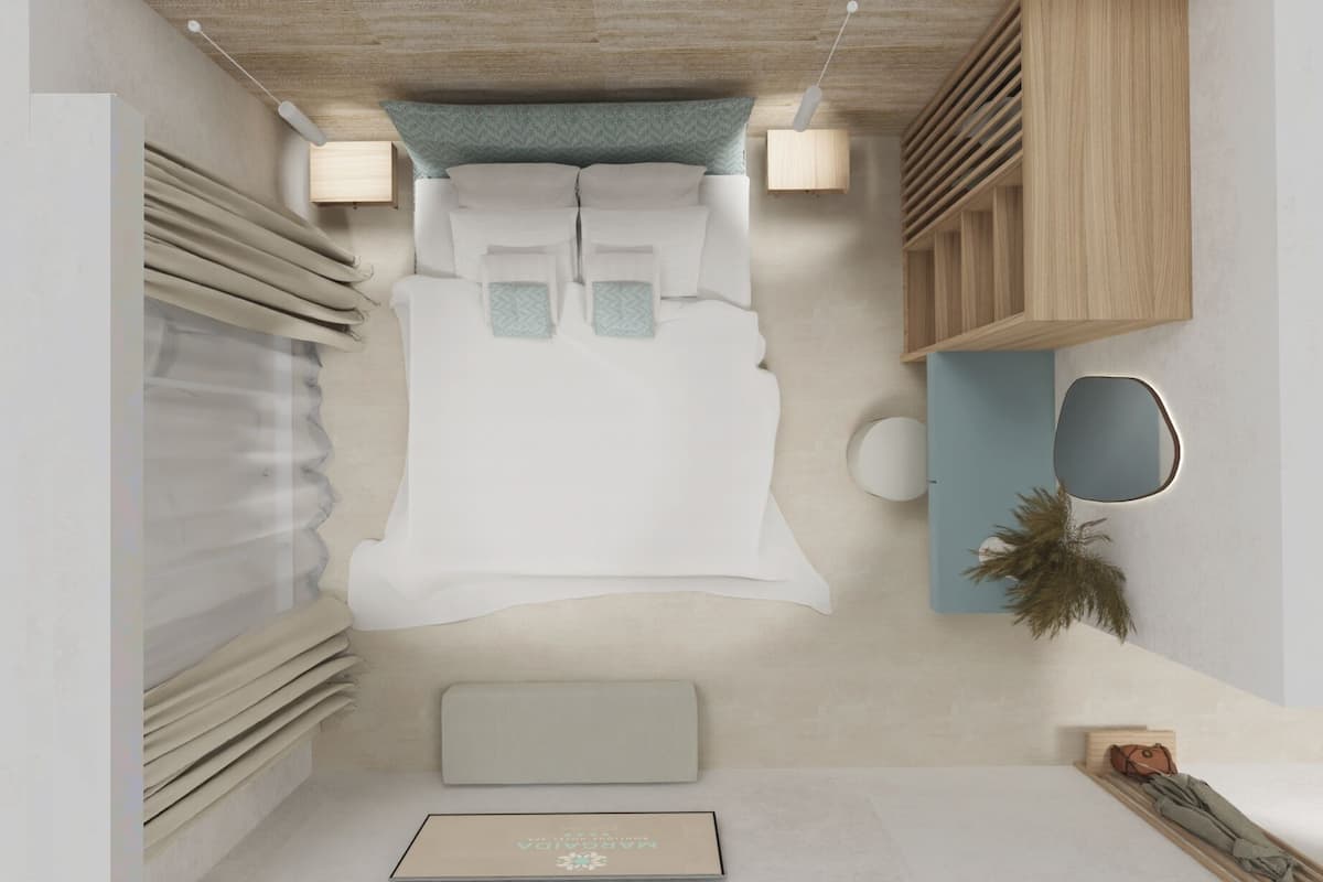 Une chambre à coucher moderne avec un lit, des tables de chevet, un miroir et une petite plante.