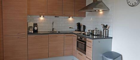 Dishwasher, coffee/tea maker, toaster, dining tables