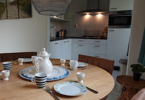 Dishwasher, coffee/tea maker, toaster, dining tables