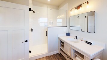 King Bed Suite | Bathroom | Shower, hair dryer, towels, soap