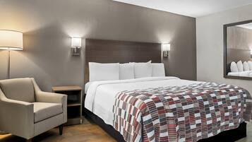 Deluxe Room, 1 King Bed, Non Smoking | 1 bedroom, desk, laptop workspace, blackout curtains