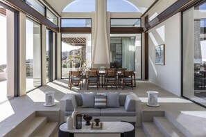 Grand Room, 4 Bedrooms (Residence, Seafront) | Living area | 55-inch Smart TV with satellite channels, fireplace - One&Only Kéa Island (Kea)