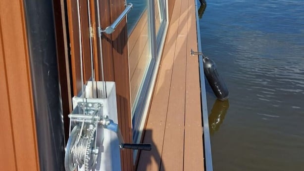 A view from a boat's window overlooking calm water, with a clear sky and distant land. - Fantastic Houseboat `Splendid` with Tender Kaag (Monnickendam)