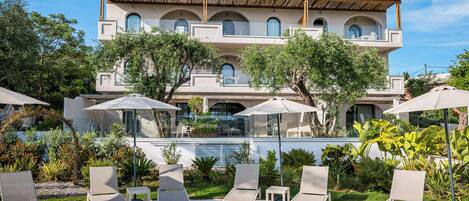 Seasonal outdoor pool, pool umbrellas, pool loungers