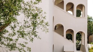 A building with multiple balconies and arched windows. - Loadstar Rooms & Suites  (Corfu)