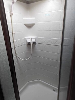 Shower, towels, soap, toilet paper