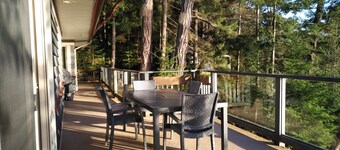 Waterfront home with stunning views, surrounded by nature.