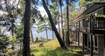 Waterfront home with stunning views, surrounded by nature.