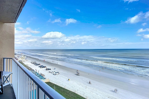 Relax with breathtaking ocean vistas, sandy shores, and blue skies from a private balcony overlooking the serene coastline. Perfect for a tranquil getaway.