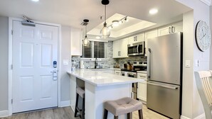 Coffee/tea maker, fridge, microwave, oven - Impressive Oceanfront Condo - Pool, BBQ & Just Steps to Flagler Ave (New Smyrna Beach)